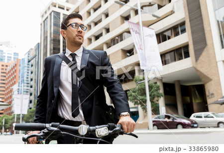 Young businessmen with a bike 33865980