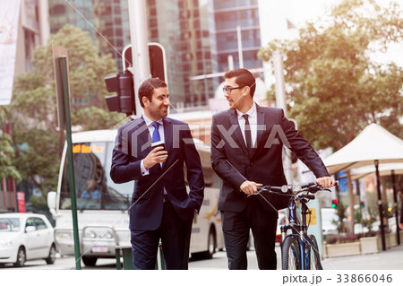 Young businessmen with a bike Young businessmen with a bike 33866046