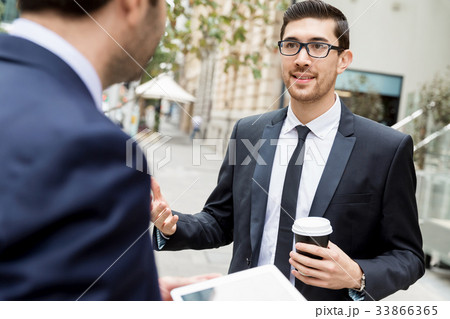 Two businessmen talking outdoors 33866365