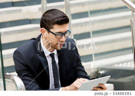 Portrait of handsome businessman outdoor 33866381