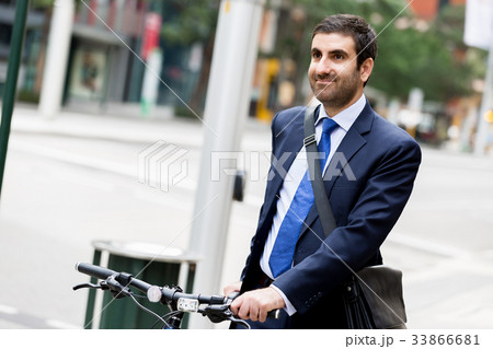 Young businessmen with a bike 33866681