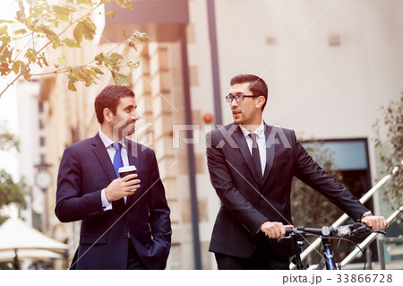 Young businessmen with a bike Young businessmen with a bike 33866728