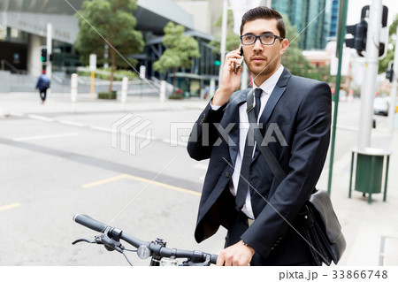 Young businessmen with a bike 33866748