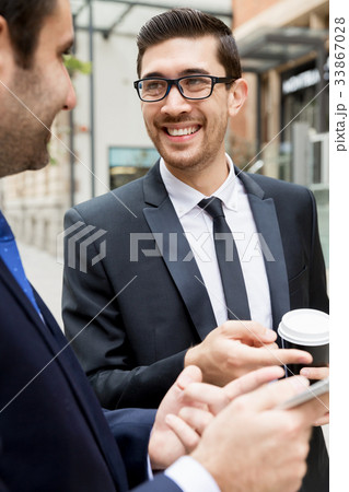 Two businessmen talking outdoors Two businessmen talking outdoors 33867028