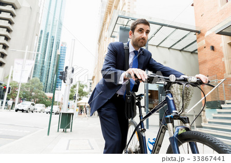 Young businessmen with a bike Young businessmen with a bike 33867441