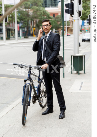 Young businessmen with a bike Young businessmen with a bike 33867442