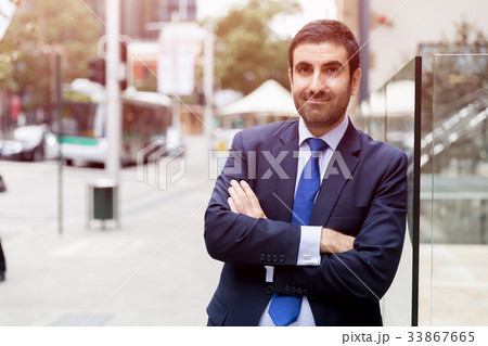 Portrait of handsome businessman outdoor 33867665