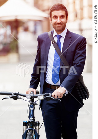 Young businessmen with a bike 33867896