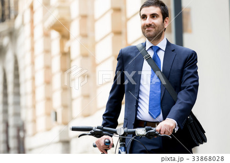 Young businessmen with a bike 33868028