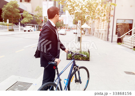 Young businessmen with a bike 33868156