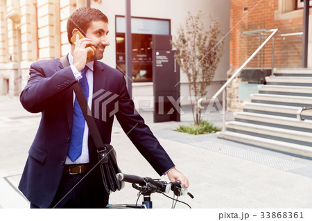 Young businessmen with a bike Young businessmen with a bike 33868361