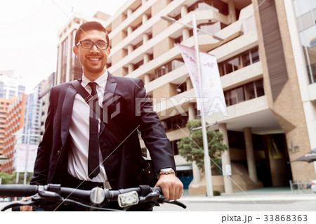 Young businessmen with a bike Young businessmen with a bike 33868363