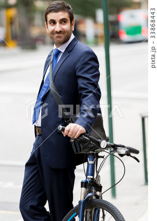 Young businessmen with a bike 33868443