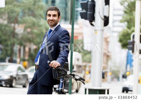 Young businessmen with a bike 33868452