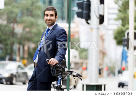 Young businessmen with a bike 33868453