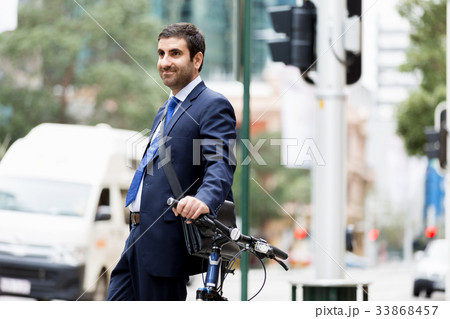 Young businessmen with a bike 33868457