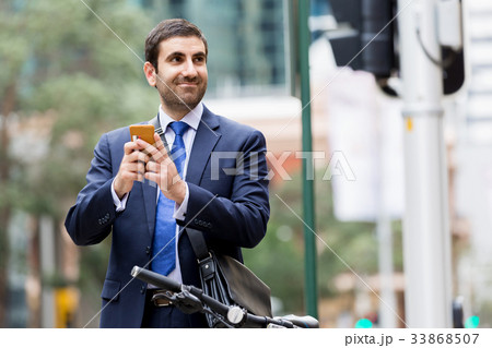 Young businessmen with a bike Young businessmen with a bike 33868507