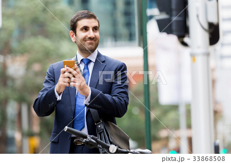 Young businessmen with a bike Young businessmen with a bike 33868508