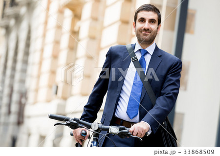 Young businessmen with a bike Young businessmen with a bike 33868509