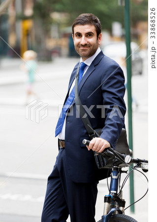 Young businessmen with a bike Young businessmen with a bike 33868526