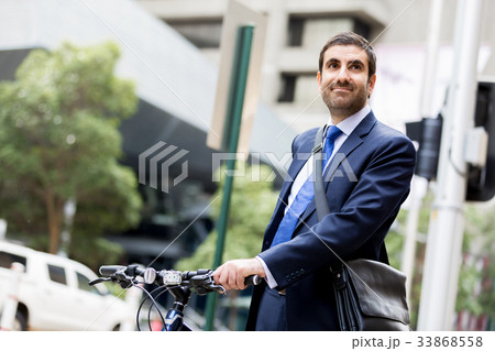 Young businessmen with a bike Young businessmen with a bike 33868558