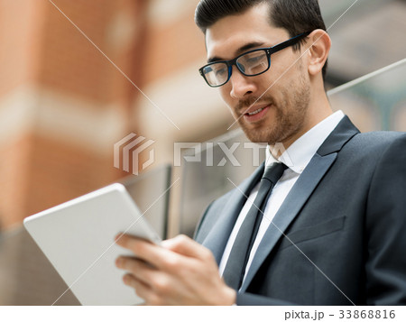 Portrait of handsome businessman outdoor 33868816
