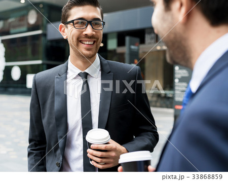 Two businessmen talking outdoors Two businessmen talking outdoors 33868859