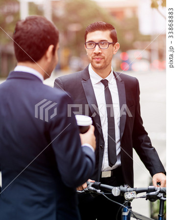 Young businessmen with a bike Young businessmen with a bike 33868883