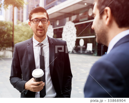 Two businessmen talking outdoors 33868904