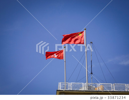 China and Hong Kong flags under blue sky 33871234