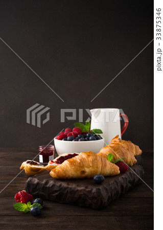 Delicious breakfast with fresh croissants 33875346