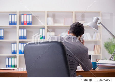 Young businessman working in the office 33875851