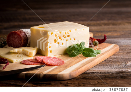 Dry salami or sausage with cheese Dry salami or sausage with cheese 33877887