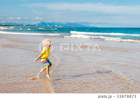 Child on tropical beach. Sea vacation with kids. 33878873