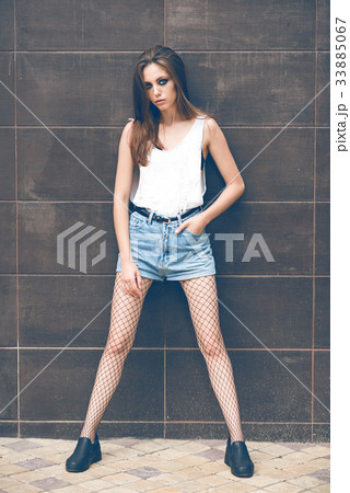 Beautiful brunette on the street Beautiful brunette on the street 33885067