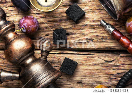 smoking hookah on plums 33885433