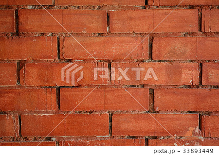 Grunge old cracked ochre brick wall background 33893449
