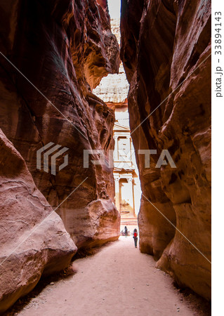 El Khasneh seen from the Canyon al-Siq, in Petra El Khasneh seen from the Canyon al-Siq, in Petra 33894143