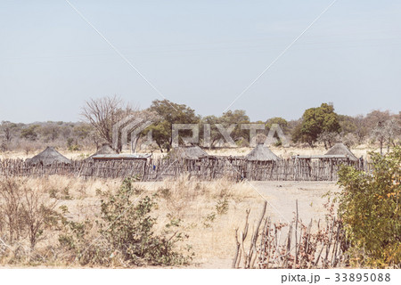 Mud straw and wooden hut in the bush, Africa 33895088