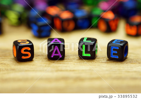 Sale words with dices on wooden table Sale words with dices on wooden table 33895532