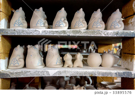 White unpainted earthenware figurines 33895576