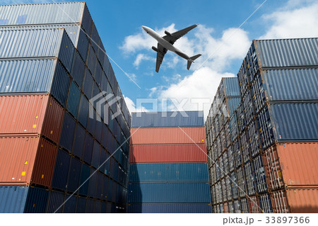 Stack of cargo containers with cargo airplane  33897366