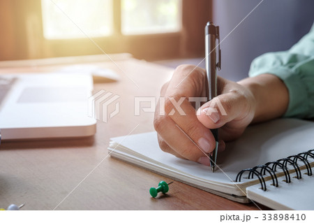Business woman hands with pen writing notebook Business woman hands with pen writing notebook 33898410