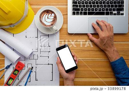 Engineer man hands holding blank screen a smartphone Engineer man hands holding blank screen a smartphone 33899178