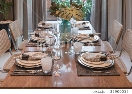 luxury table set on wooden dining table 33900055