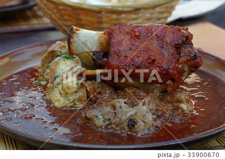 Portion of roasted pork shank with dumplings Portion of roasted pork shank with dumplings 33900670