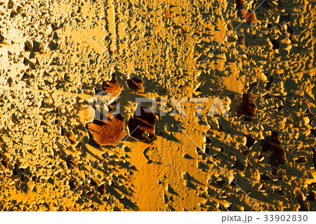 Old rusty metal in golden light as background 33902830