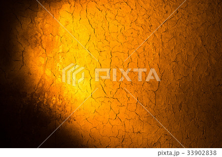 Clay wall in golden light as background Clay wall in golden light as background 33902838
