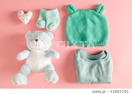 Baby clothes and teddy bear Baby clothes and teddy bear 33903105