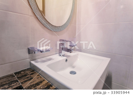 white basins in bathroom interior with tiles white basins in bathroom interior with tiles 33905944